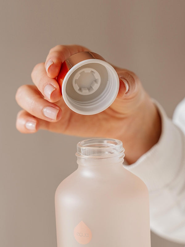 EQUA glass water bottle Bloom and the mouth of the bottle with lid cover.