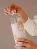 EQUA glass water bottle Heavens with faux leather cover.