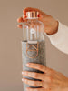 Removing the cover of EQUA glass water bottle Rose Gold.