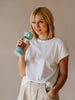 Girl holding a water bottle with Mint upper and bottom silicone