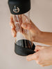 Active Black bouteille en verre avec protection en silicone