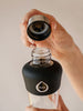 Active Black glass bottle with metallic lid