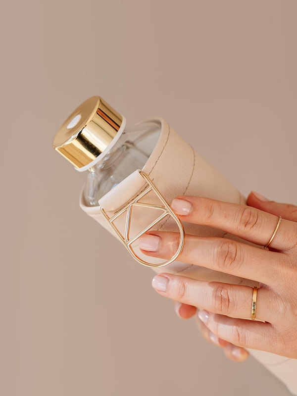 EQUA glass water bottle in beige colour.
