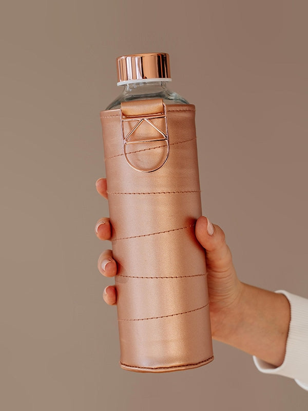 Holding with one hand EQUA Bronze glass water bottle