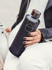 EQUA glass water bottle Graphite with faux leather cover.