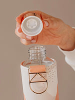 EQUA glass water bottle Heavens and the mouth of the bottle with the lid cover.