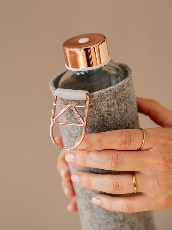 EQUA glass water bottle Rose Gold with felt cover.