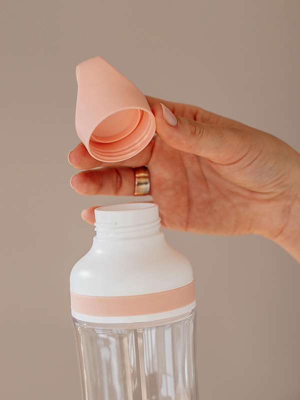 EQUA BPA FREE FLOW water bottle, Beat, close up of the lid and mouthpiece, peach color