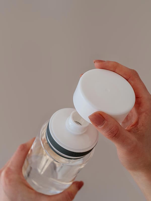 EQUA BPA FREE water bottle, Plain White, close up of the lid and mouthpiece, white color