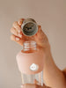 Active Peach glass water bottle with lid details
