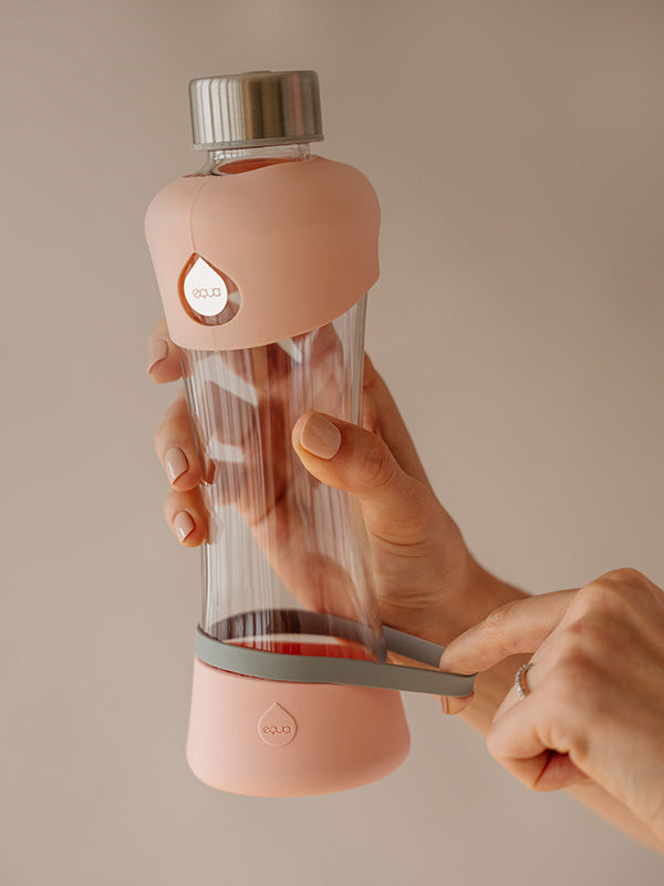 Active Peach botella de agua de cristal con detalles de protección de silicona