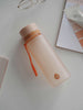 EQUA BPA FREE water bottle, Sunrise, water bottle on the office table, minimalistic design, no motif, peach color