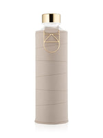 EQUA Beige glass water bottle on white paper