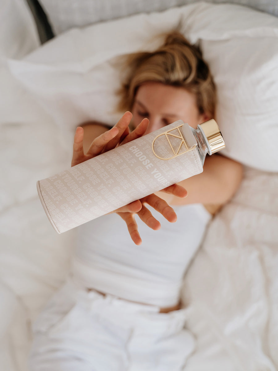 Girl holding with both hands Mismatch Choose Yourself glass water bottle